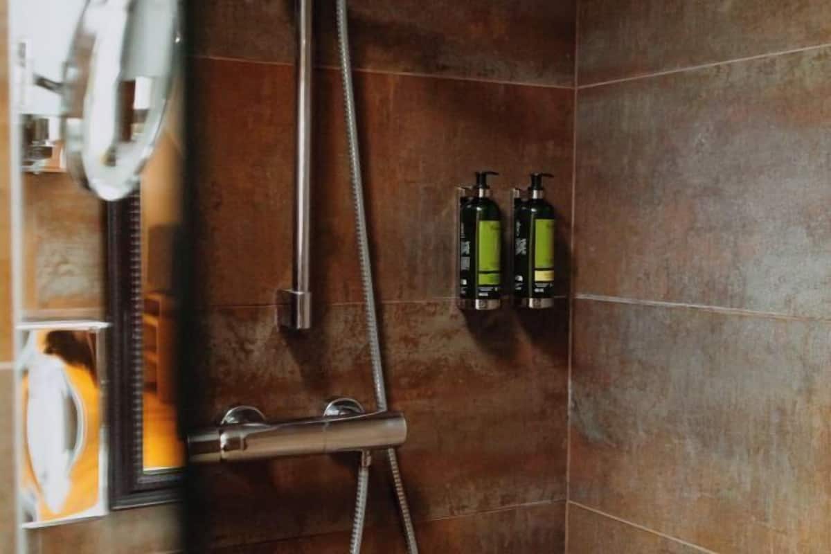 Bathroom | Designer toiletries, hair dryer, bathrobes, slippers