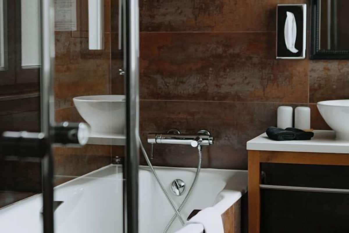 Bathroom | Designer toiletries, hair dryer, bathrobes, slippers