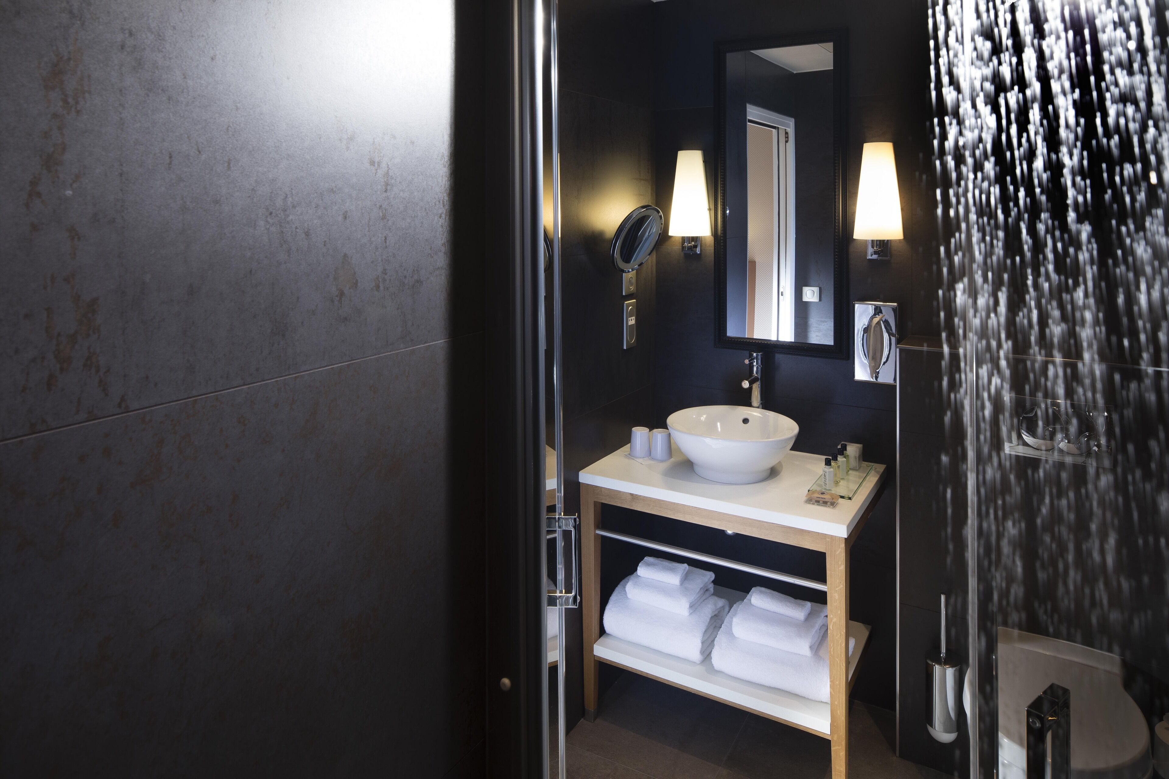 designer toiletries, hair dryer, bathrobes, slippers