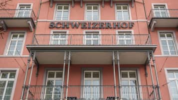 A hotel facade with the name 'SCHWEIZERHOF' prominently displayed.