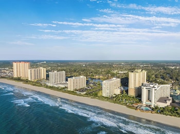 On the beach, white sand at Embassy Suites by Hilton Myrtle Beach Oceanfront Resort