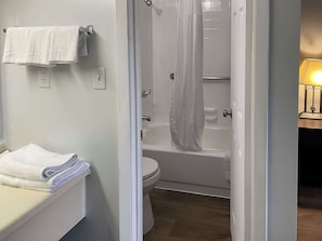 Standard Room, 2 Queen Beds, Non Smoking | Bathroom | Combined shower/tub, free toiletries, towels