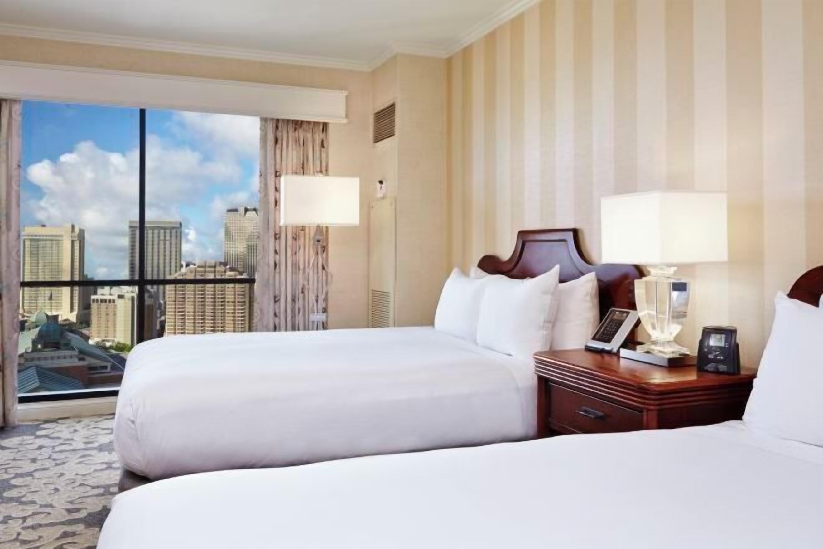 Premium bedding, down duvets, pillow-top beds, in-room safe