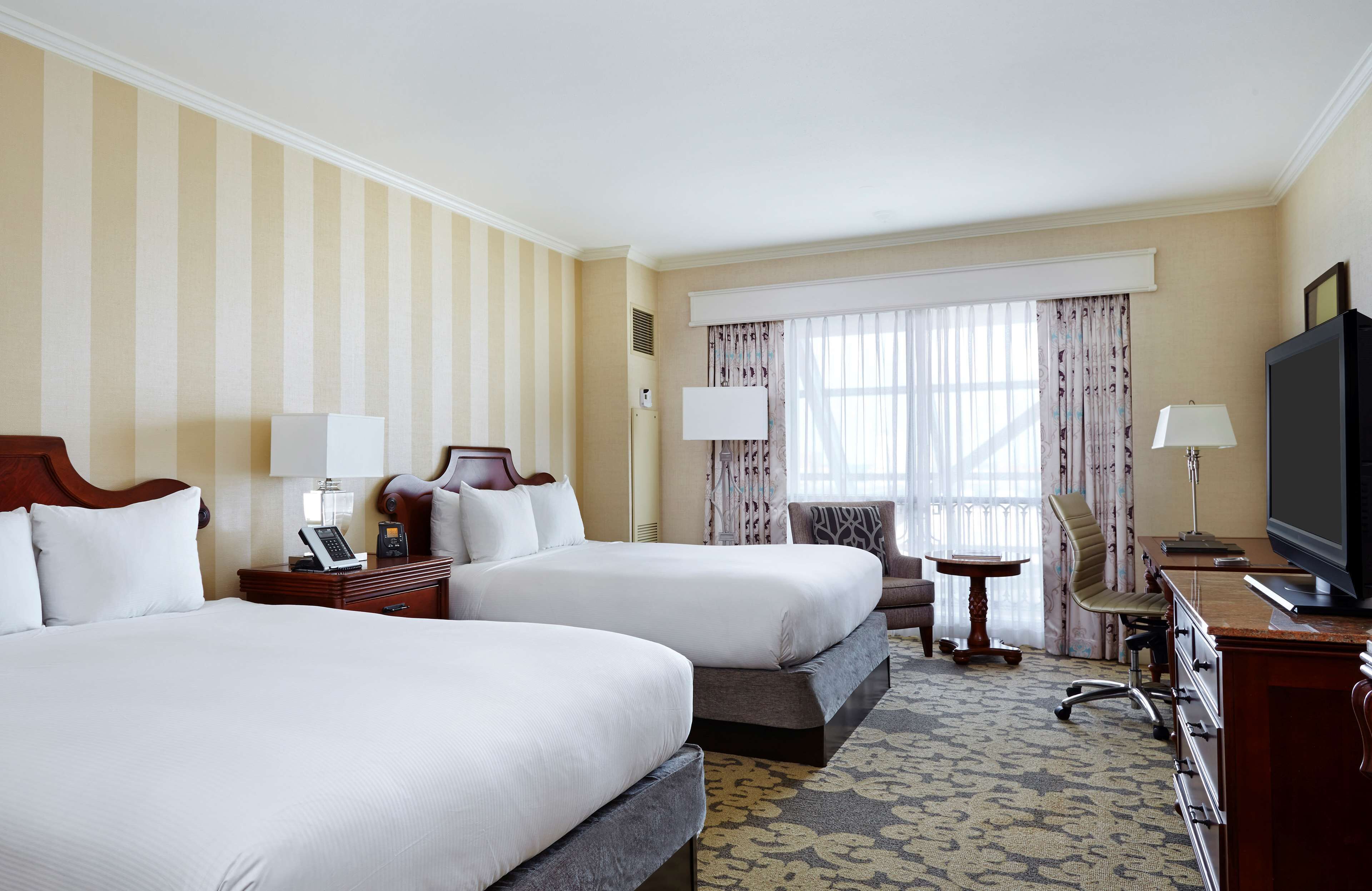 Premium bedding, down comforters, pillowtop beds, in-room safe