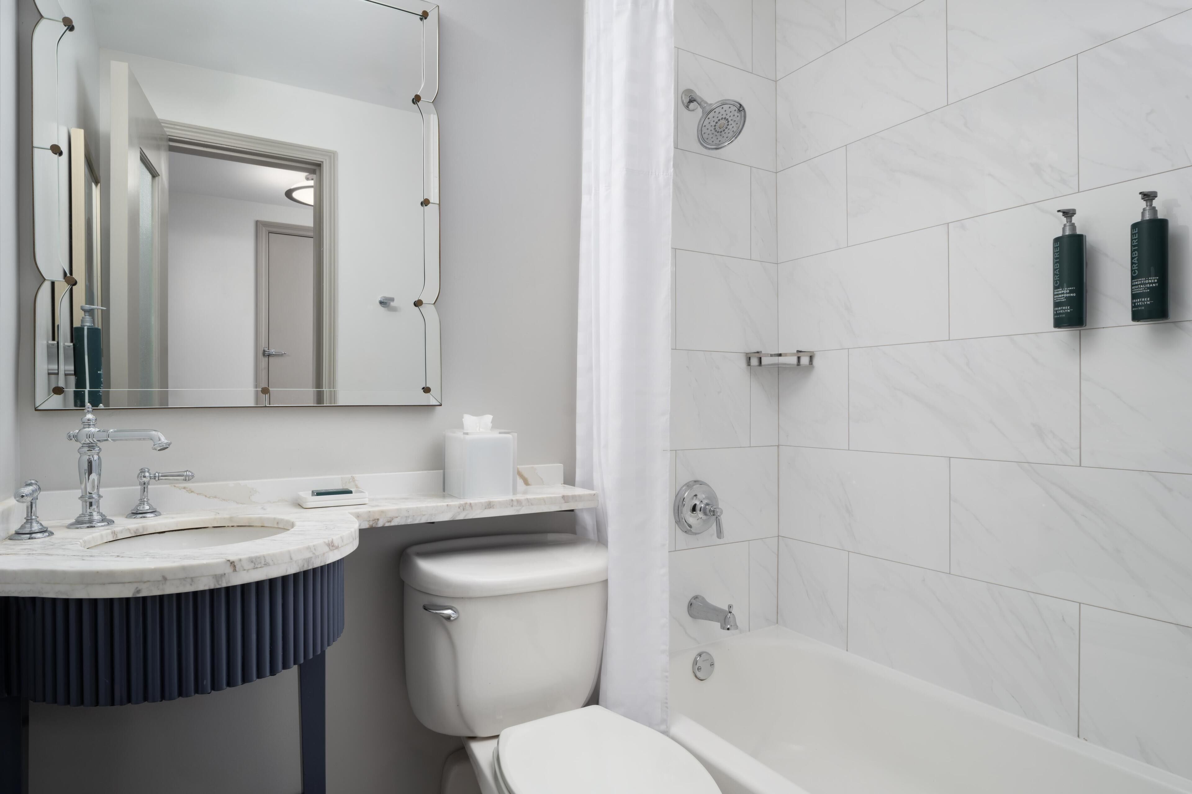 Designer toiletries, hair dryer, towels, soap