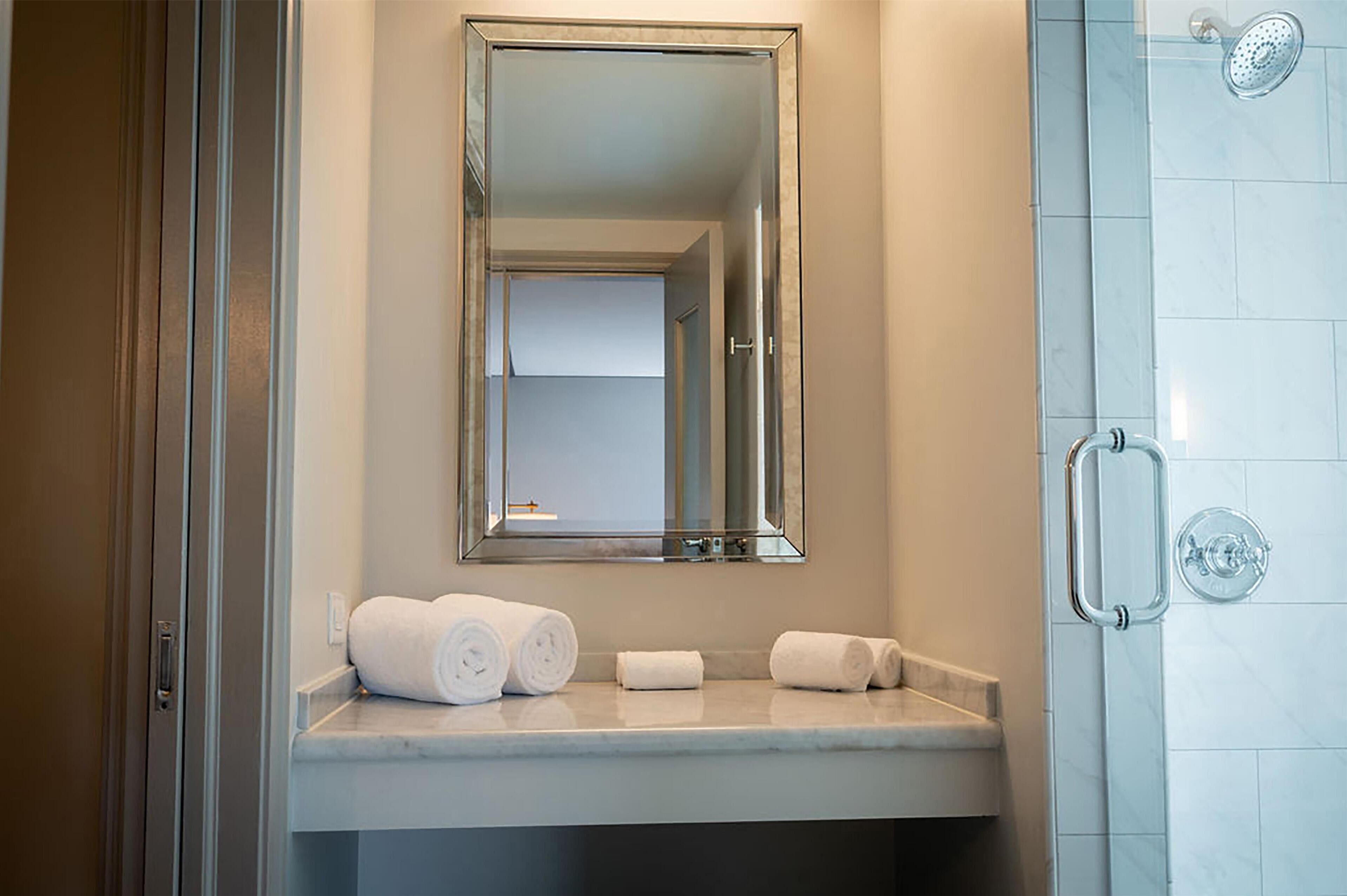 Designer toiletries, hair dryer, towels, soap