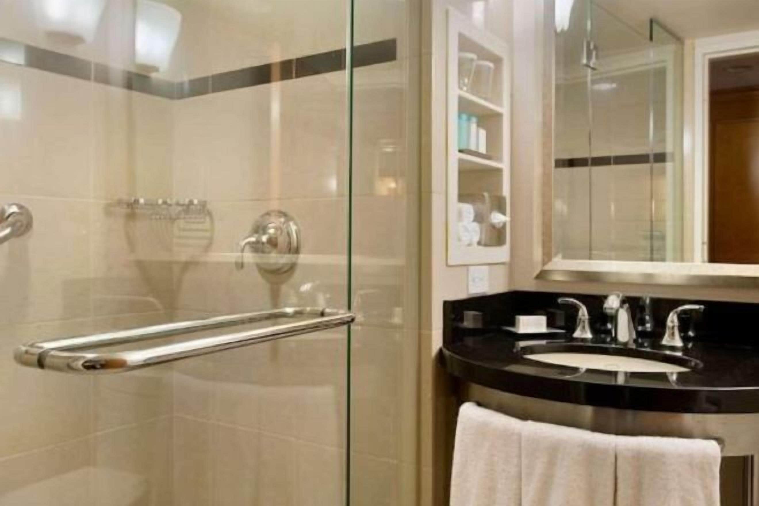 Designer toiletries, hair dryer, towels