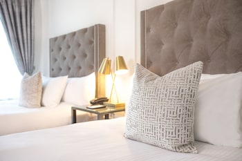 Egyptian cotton sheets, premium bedding, down comforters, in-room safe at The Culver Hotel