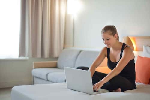 Hypo-allergenic bedding, desk, laptop workspace, blackout drapes