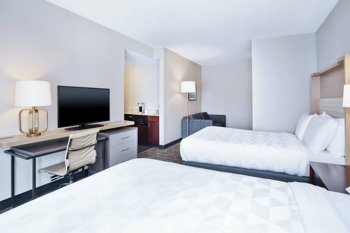 Suite, 2 Queen Beds | In-room safe, desk, iron/ironing board, free cribs/infant beds