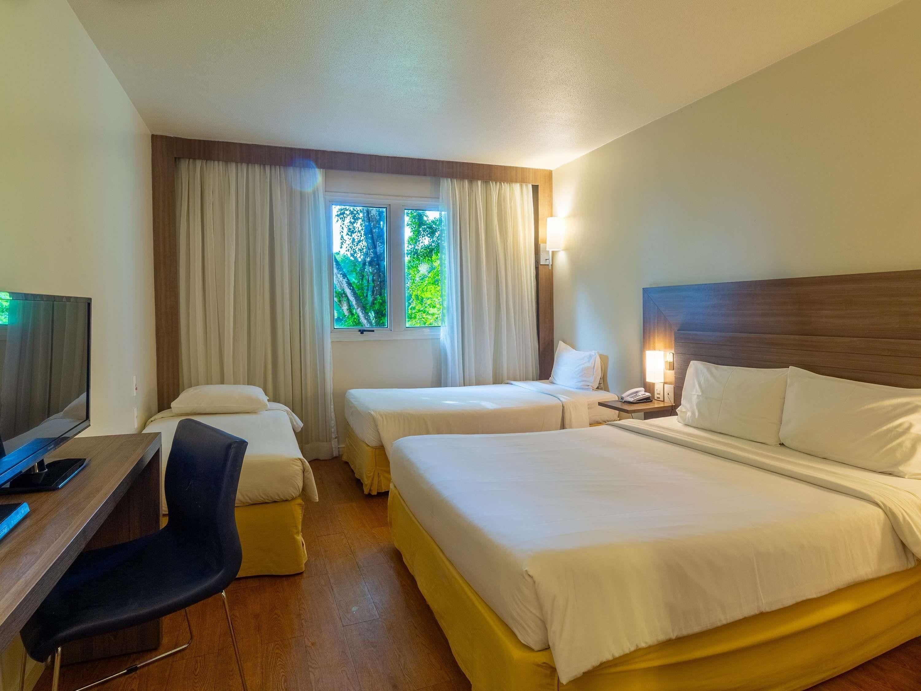 Family Room, Multiple Beds | Minibar, in-room safe, desk, blackout drapes