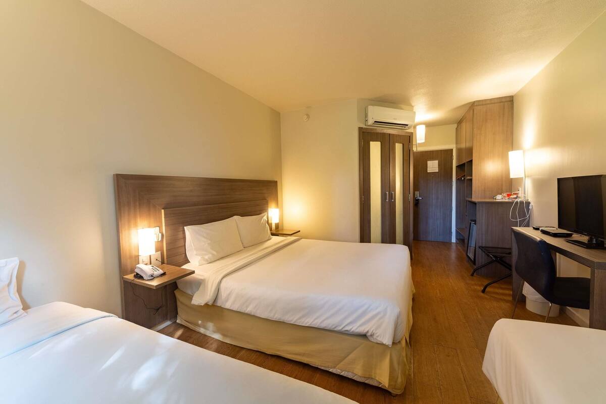 family room, multiple beds | minibar, in-room safe, desk, blackout curtains