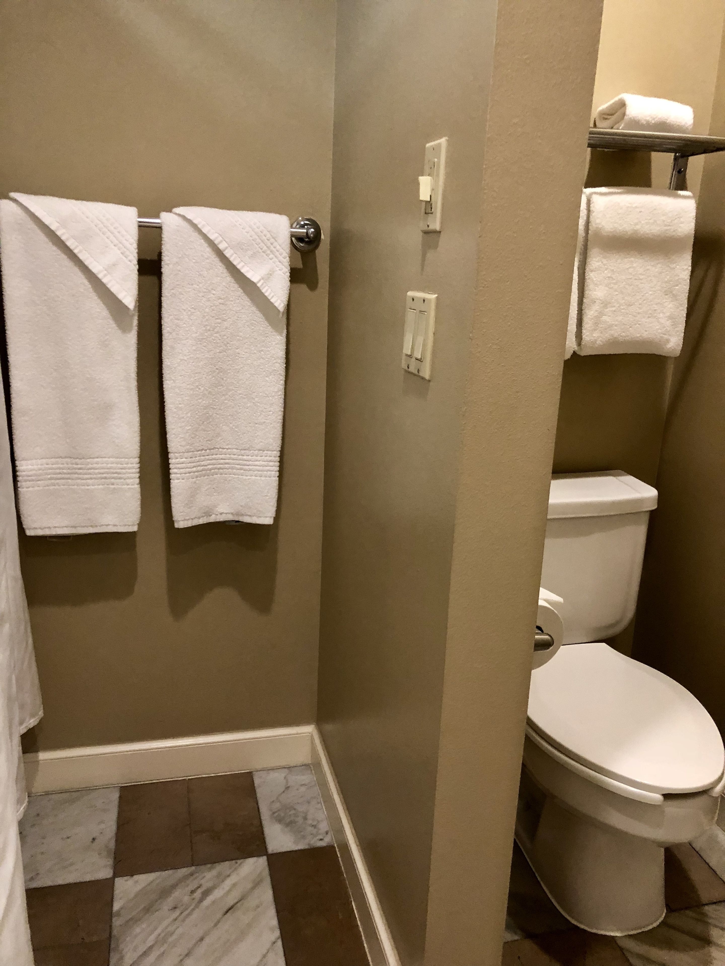 combined shower/bathtub, designer toiletries, hair dryer, bathrobes