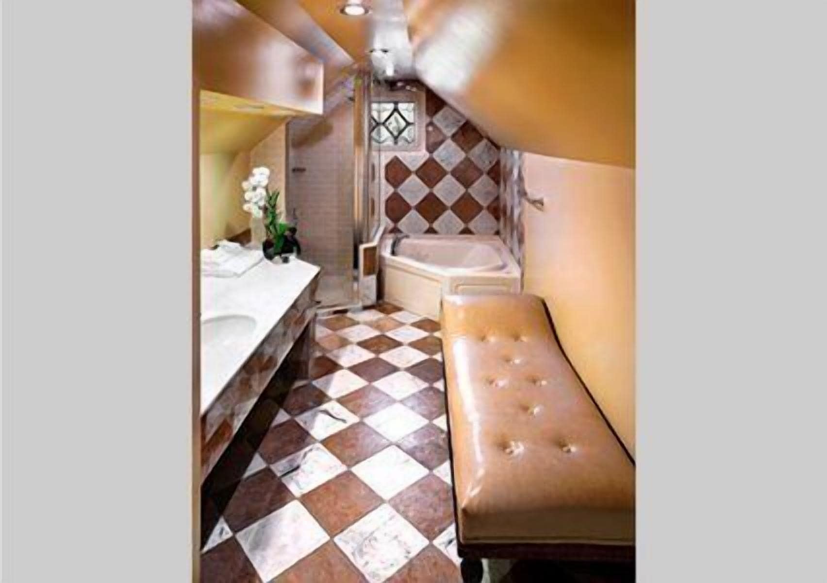 combined shower/bathtub, designer toiletries, hair dryer, bathrobes