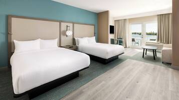 Suite, plusieurs lits, balcon, vue baie | Literie de qualité supérieure, coffres-forts dans les chambres