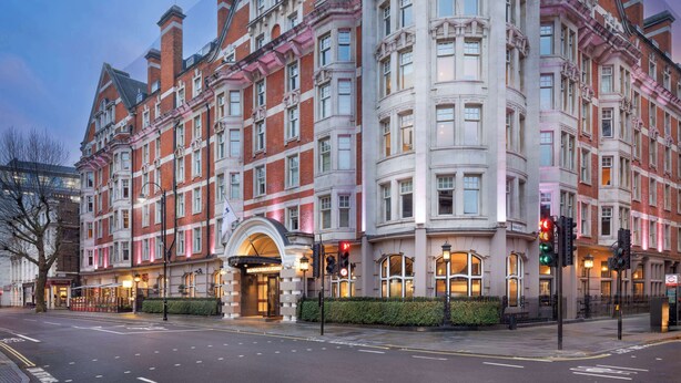 A large, historic building with multiple stories, large windows, and a prominent entrance. - Radisson Blu Hotel, London Bloomsbury (London)