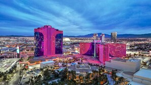 A high-rise hotel with a modern architectural design, featuring a prominent vertical stripe pattern.