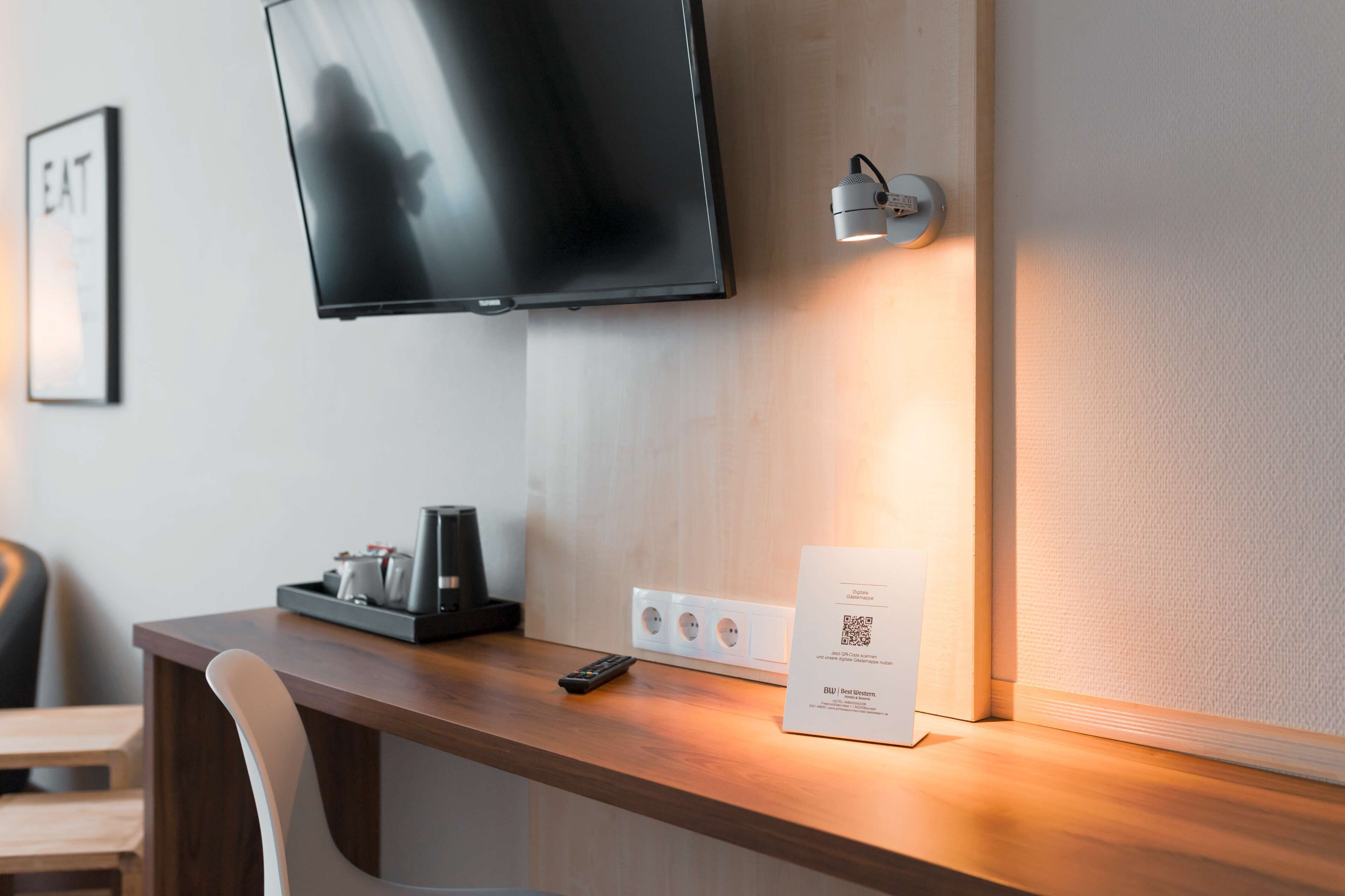 comfort room, 1 queen bed (cozy sitting corner) | in-room safe, laptop workspace, blackout curtains, soundproofing