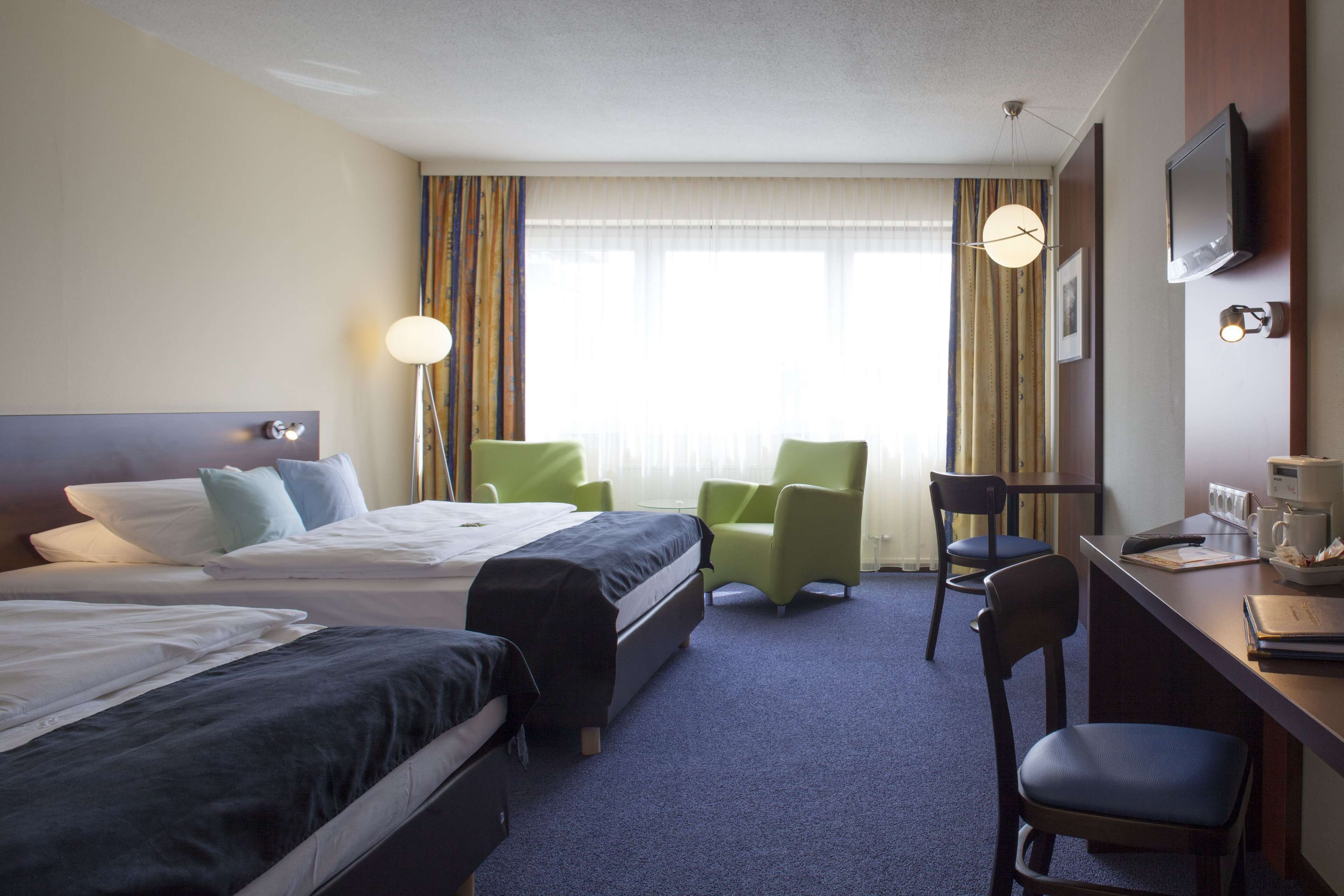 family room, 2 queen beds (cozy sitting corner) | in-room safe, laptop workspace, blackout curtains, soundproofing