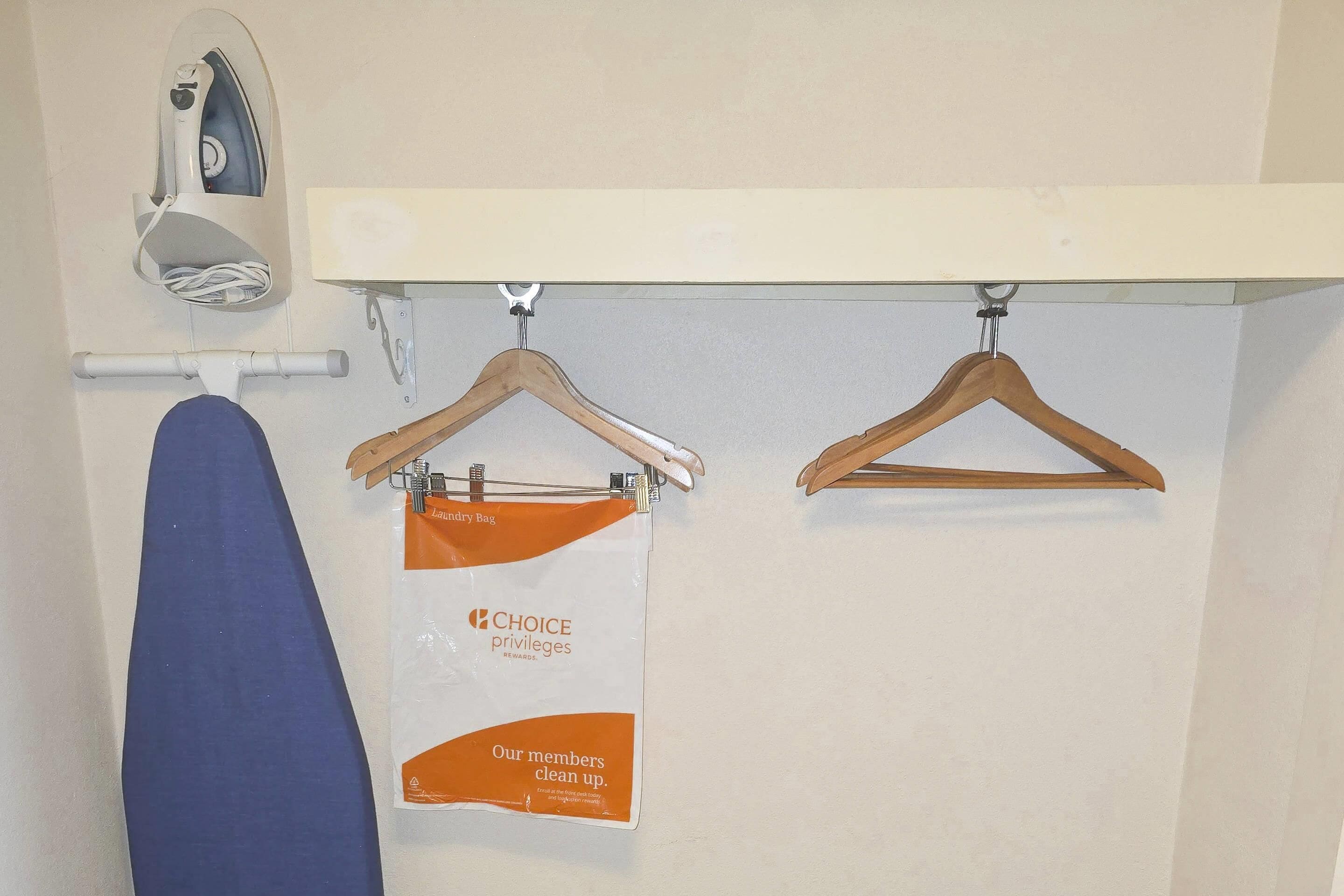 laptop workspace, blackout curtains, soundproofing, iron/ironing board