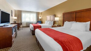 A hotel room with two beds, a desk with a television, and a window with curtains. - Comfort Inn Payson (Payson)