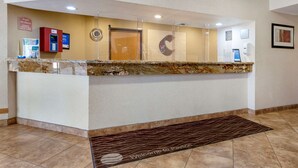 A reception area with a marble counter, a red information kiosk, a phone, and a welcome mat. - Comfort Inn Payson (Payson)