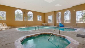 A pool area with multiple pools, sun loungers, and a no diving sign. - Comfort Inn Payson (Payson)