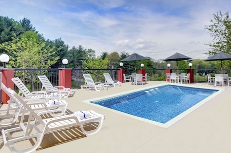 Seasonal outdoor pool, open 10 AM to 10 PM, sun loungers. Clarion Pointe Biltmore Village