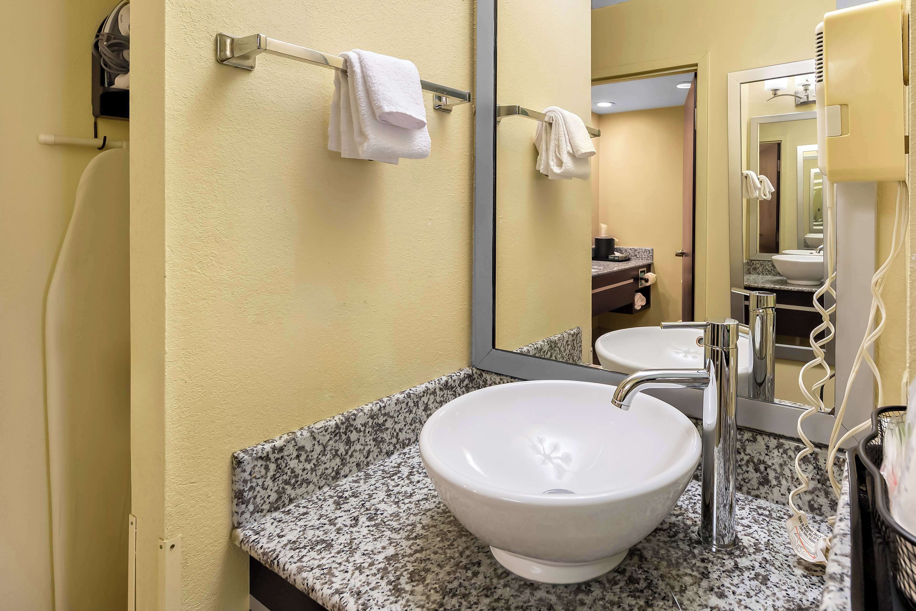 suite, 1 king bed, non smoking, refrigerator & microwave | bathroom | combined shower/bathtub, eco-friendly toiletries, hair dryer, towels