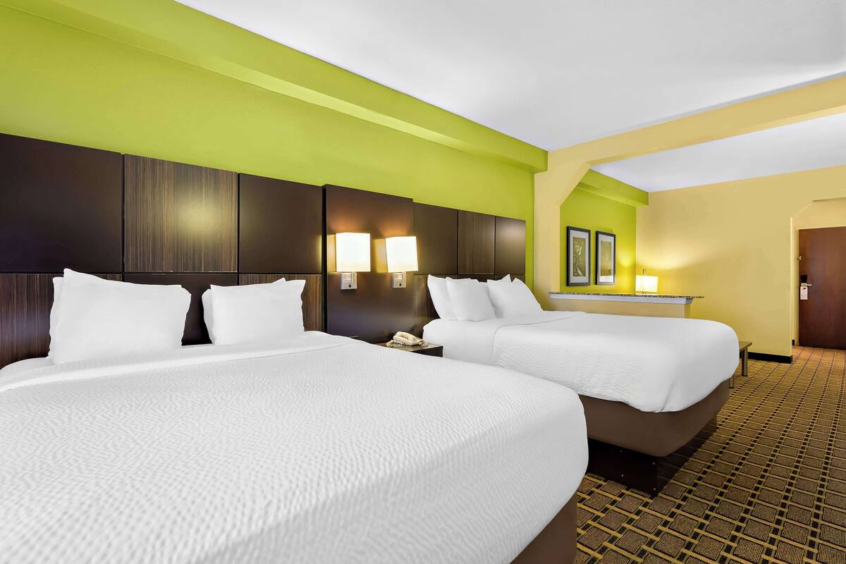 suite, 2 queen beds, non smoking, refrigerator & microwave (third bed is a sofabed) | in-room safe, iron/ironing board, free cots/infant beds, free wifi