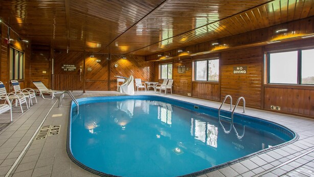 An indoor swimming pool with wooden walls, a tiled floor, and a 'NO DIVING' sign. - Quality Inn & Suites Bloomington I-55 and I-74 (Bloomington)