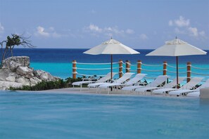 2 outdoor pools, pool umbrellas, sun loungers