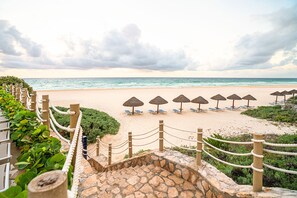 On the beach, sun loungers, beach towels
