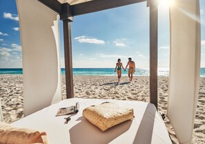 On the beach, sun-loungers, beach towels