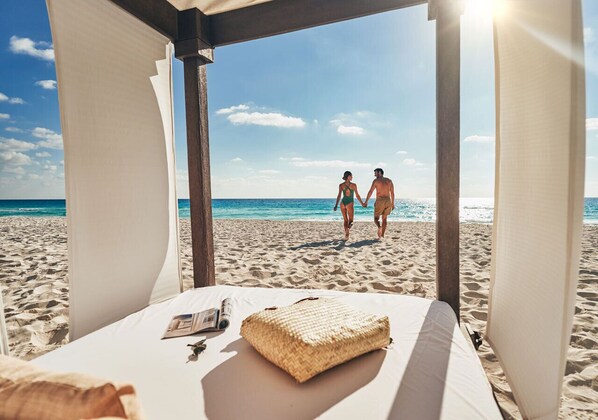 On the beach, sun loungers, beach towels