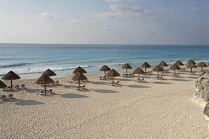 On the beach, sun loungers, beach towels