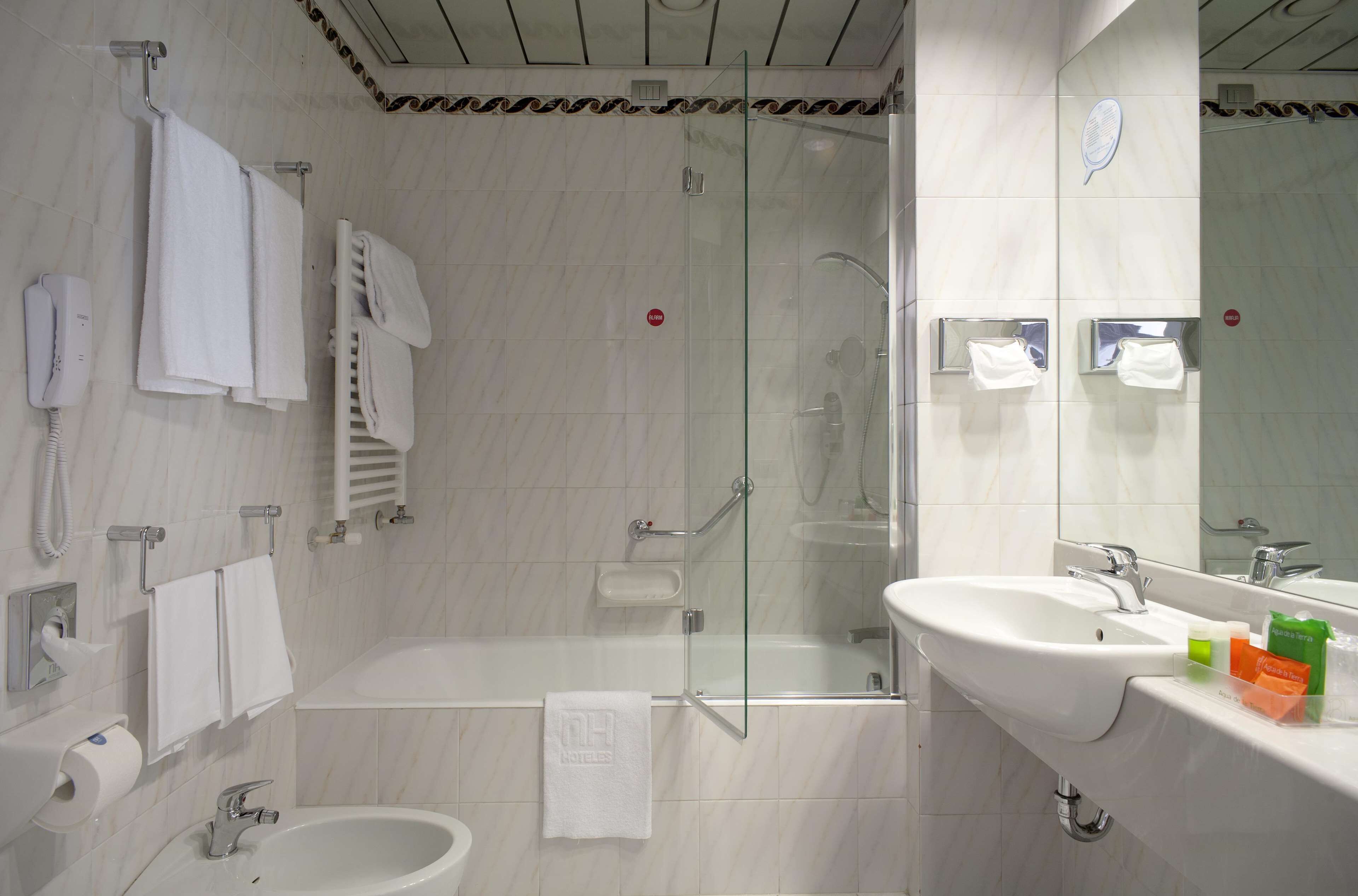 eco-friendly toiletries, hair dryer, bidet, towels