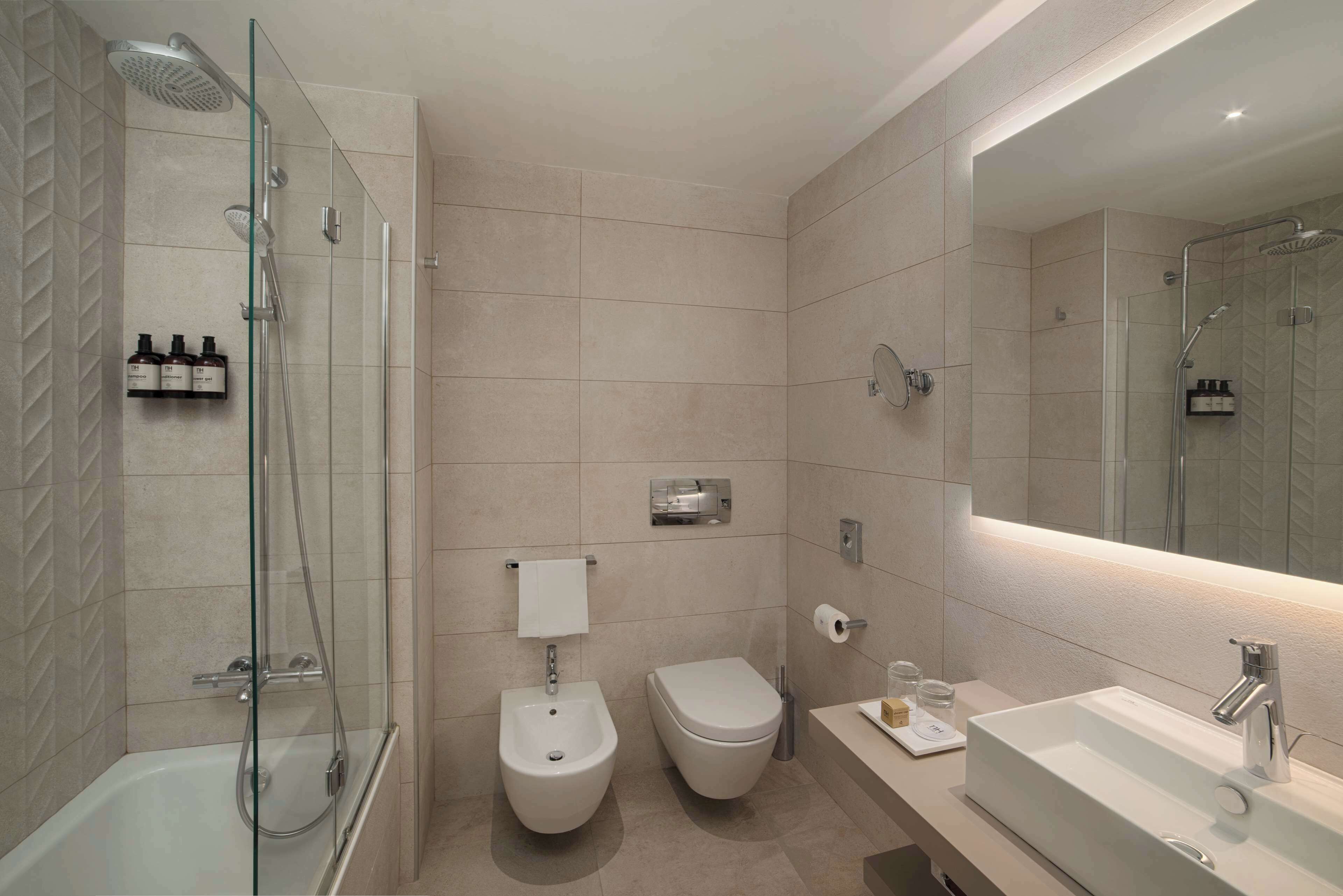 eco-friendly toiletries, hair dryer, bidet, towels