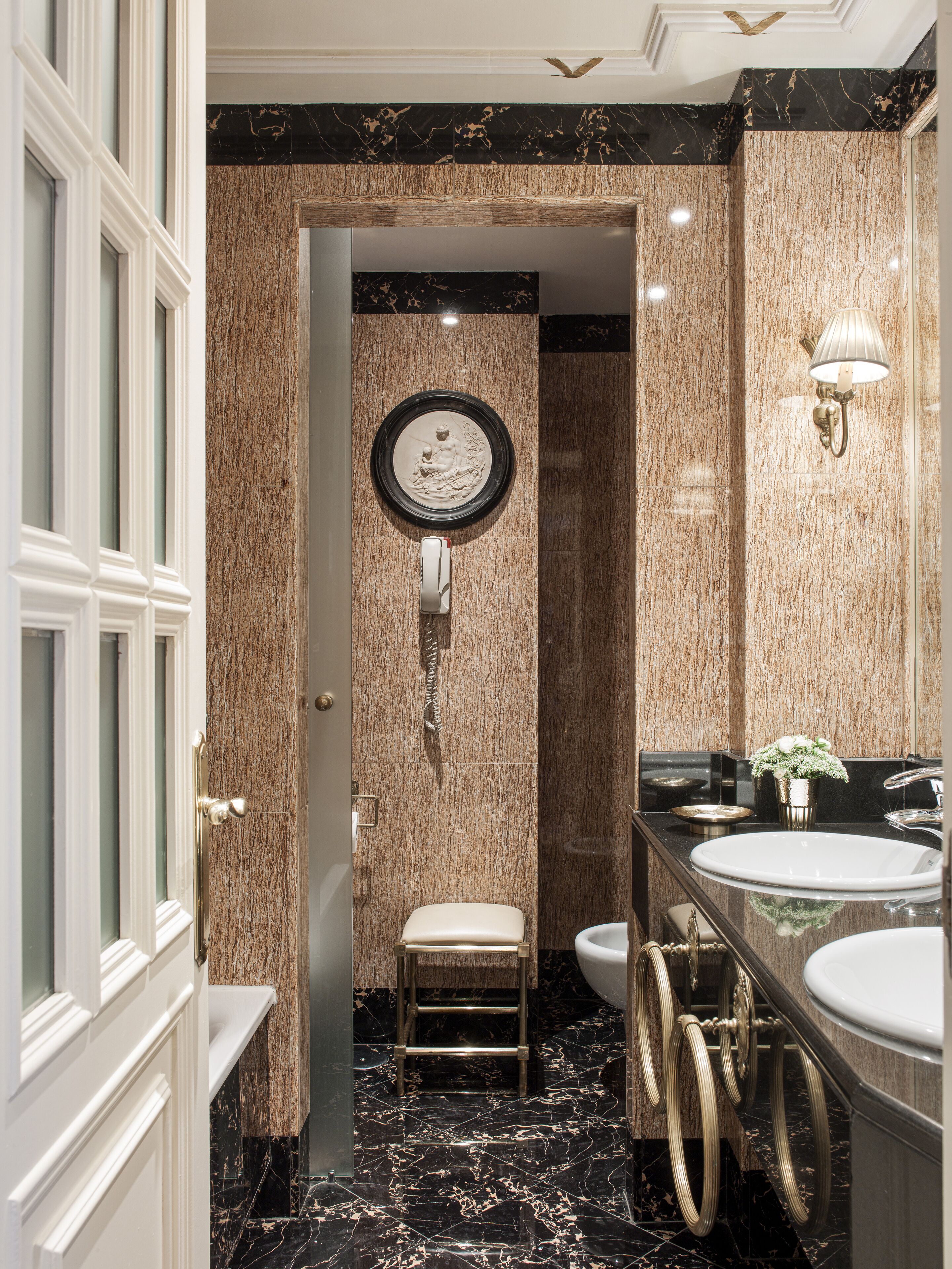 deep-soaking bathtub, hydromassage showerhead, designer toiletries