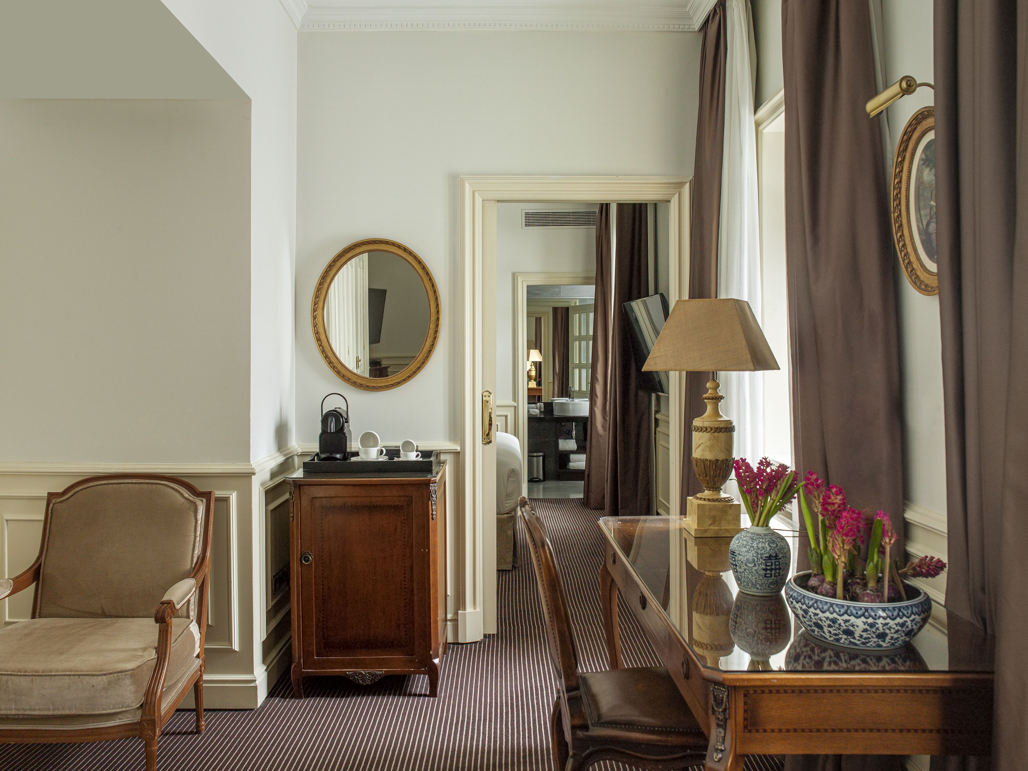 deep-soaking bathtub, hydromassage showerhead, designer toiletries