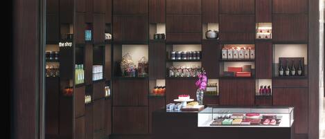A modern retail space with wooden paneling and glass display cases.