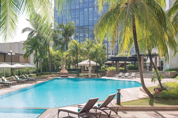 Outdoor pool, sun loungers, lifeguards on site