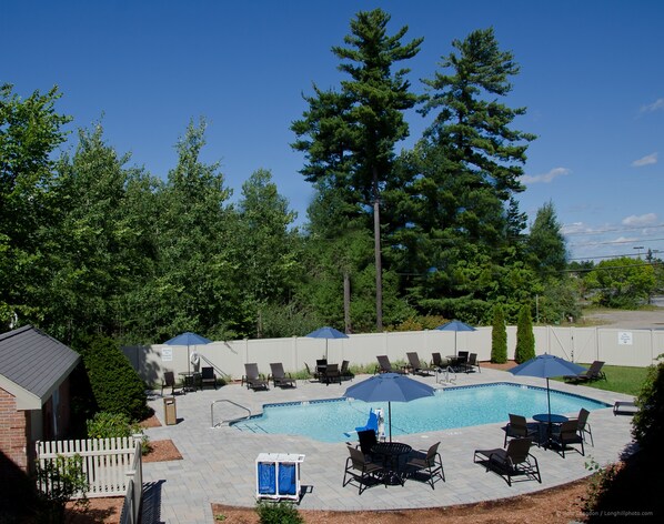 Outdoor pool, open 10 AM to 9 PM, pool loungers