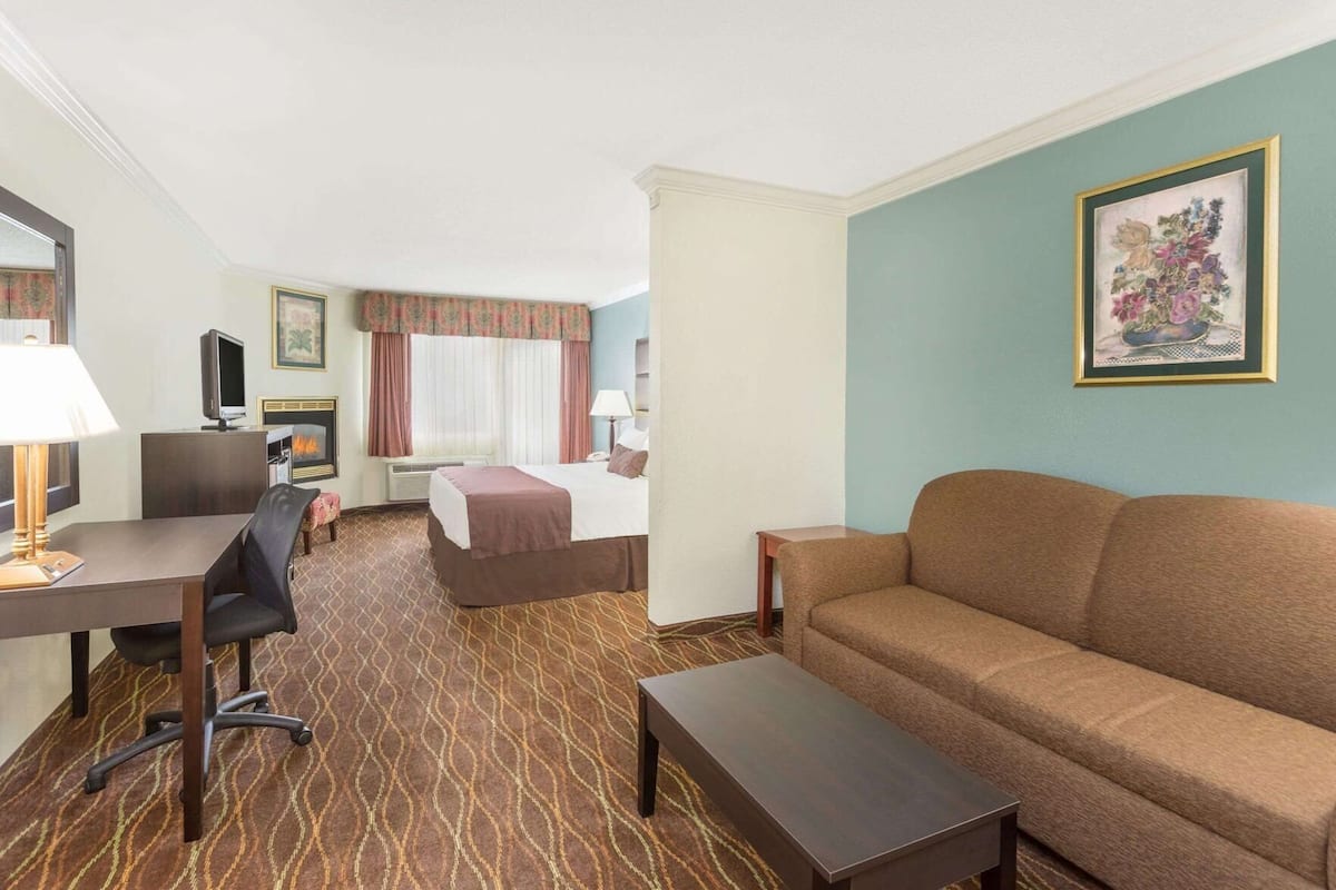 Desk, blackout drapes, iron/ironing board, rollaway beds