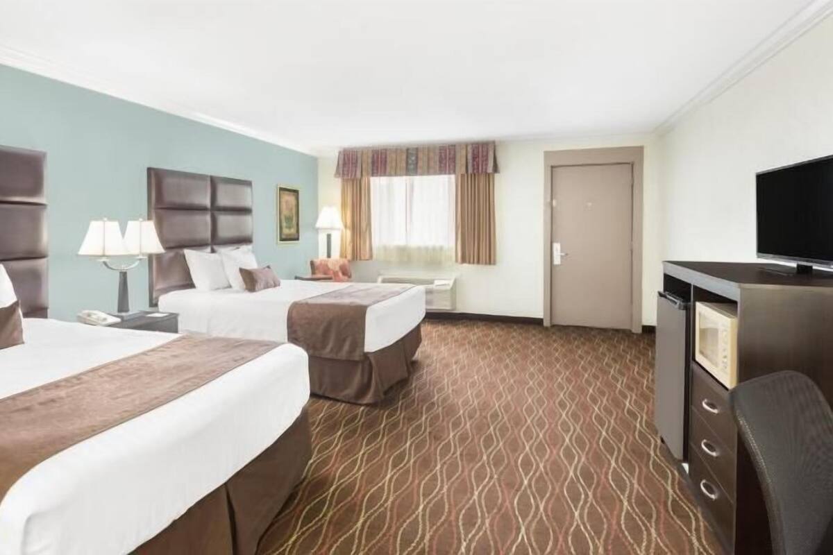 Desk, blackout drapes, iron/ironing board, rollaway beds