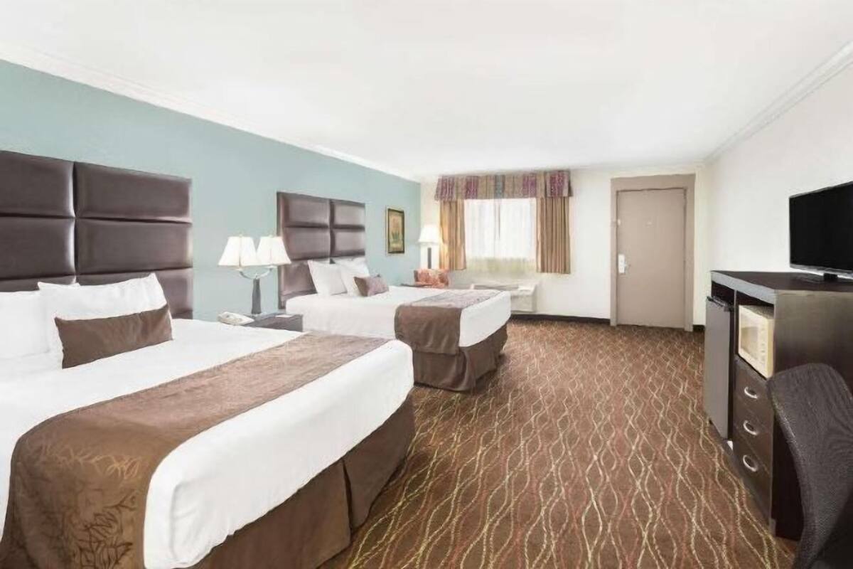 Desk, blackout curtains, iron/ironing board, rollaway beds