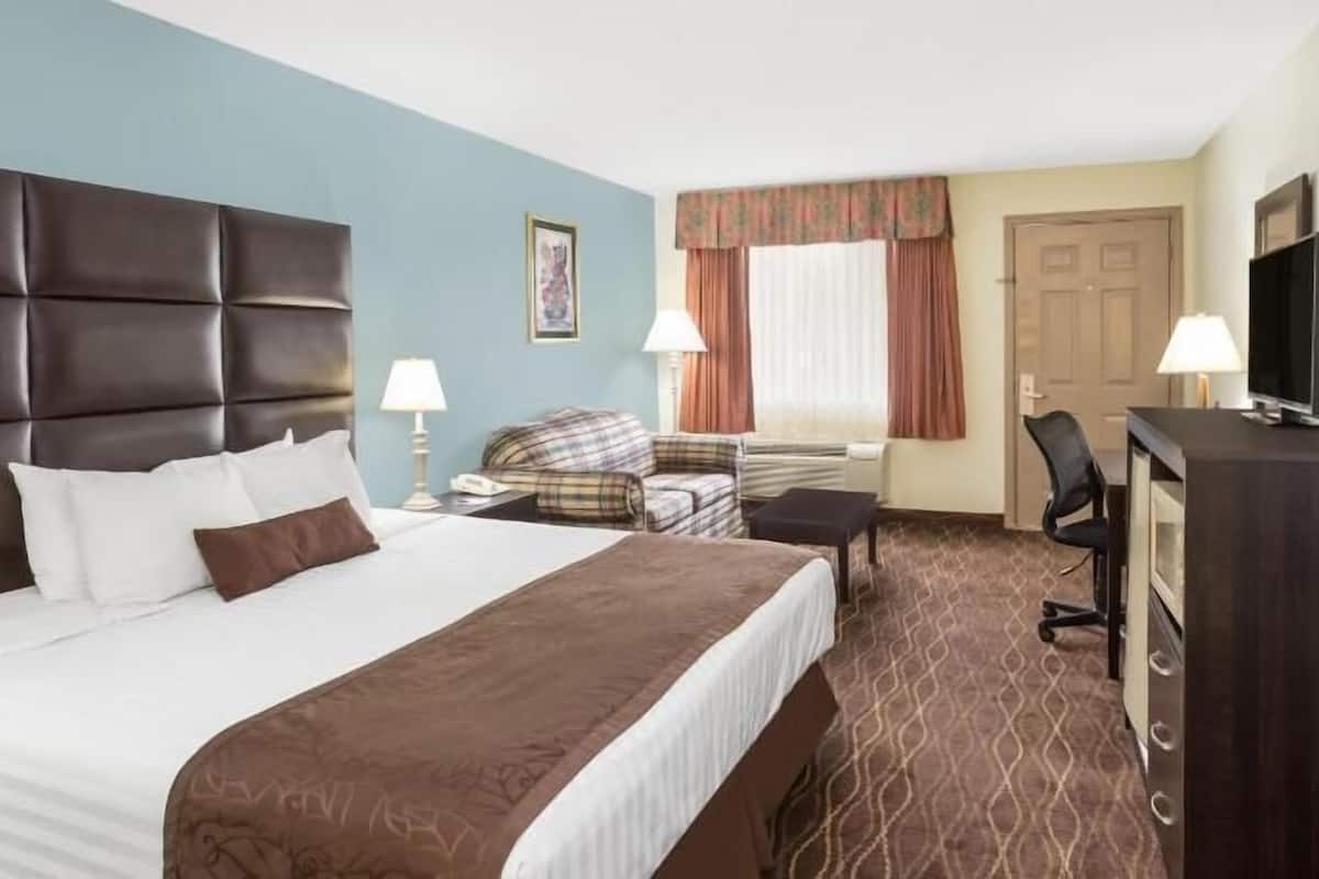 Desk, blackout drapes, iron/ironing board, rollaway beds