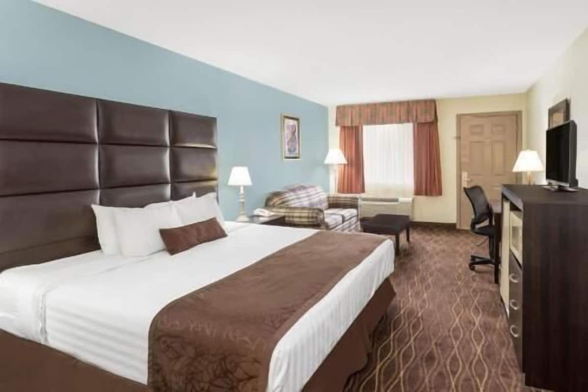 Desk, blackout drapes, iron/ironing board, rollaway beds