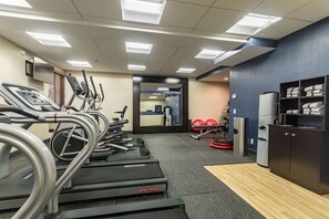 Work out in style with our fully equipped gym featuring treadmills, exercise balls, and ample space.
