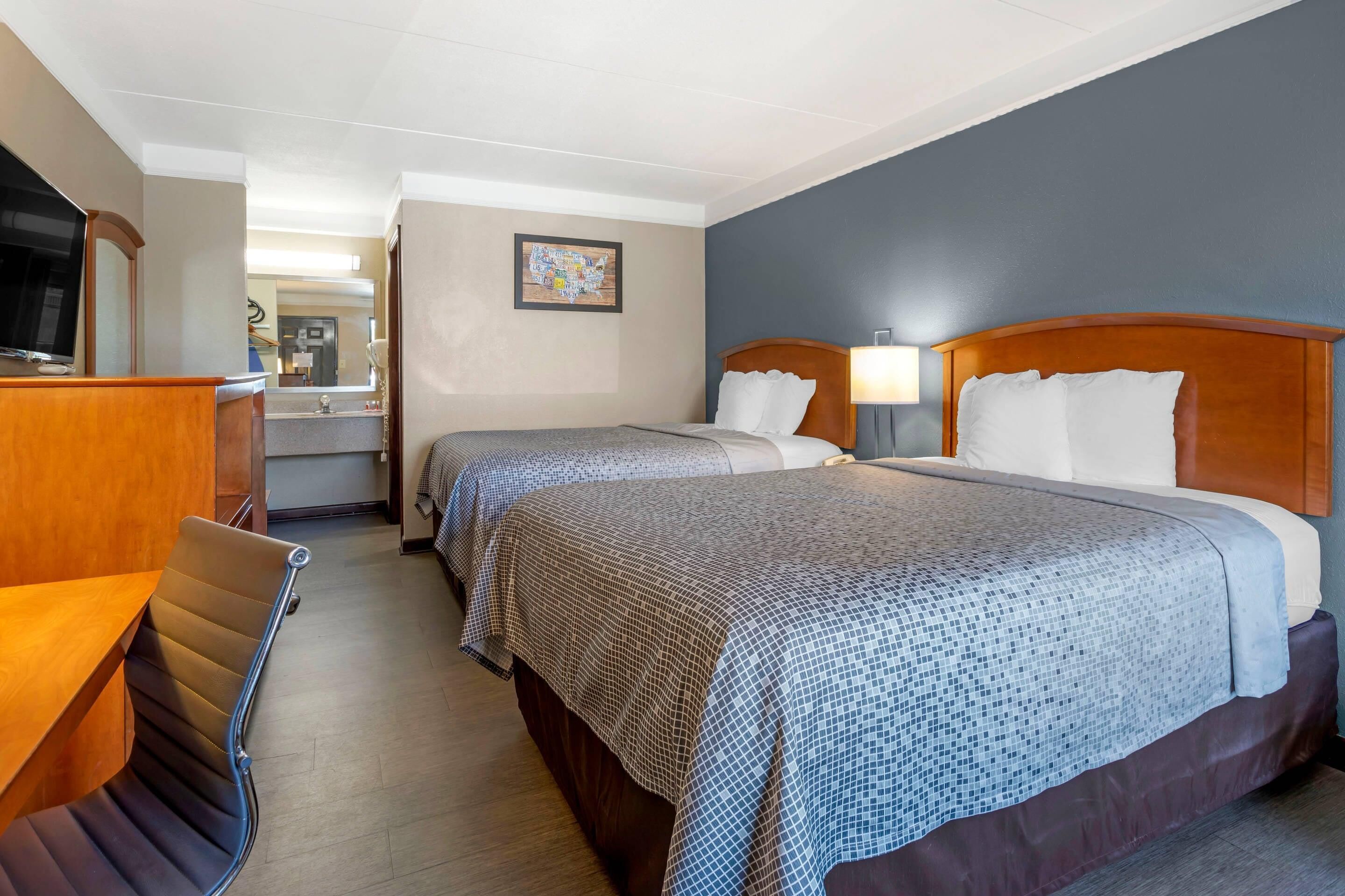 Room, 2 Queen Beds, Smoking | In-room safe, iron/ironing board, free WiFi, bed sheets